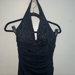 Floor length dress, halter with rhinestones on chest. Ruching down dress